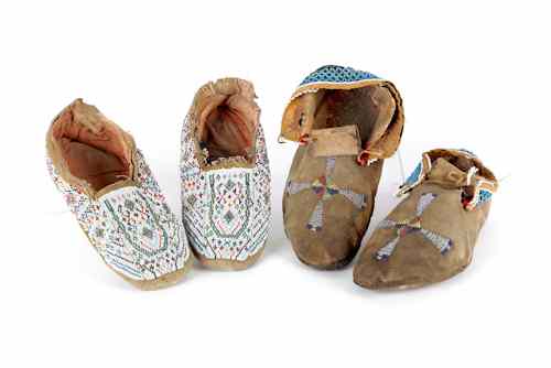 Appraisal: Two pairs of Native American beaded hide moccasins l and