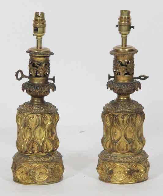 Appraisal: A pair of th Century pressed brass oil lamp bases