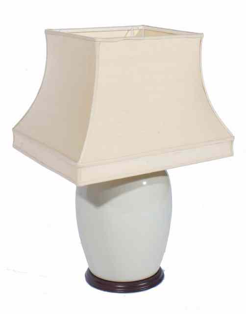 Appraisal: A CREAM GLAZED TABLE LAMP of ovoid form complete with