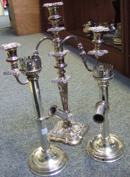 Appraisal: Plated wares comprising a three light table candelabra on a