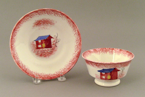 Appraisal: Red spatter cup and saucer th c with shed