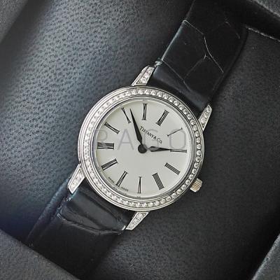 Appraisal: TIFFANY CO PLATINUM AND DIAMOND WATCH Mid-sized four-bodied screw-down case