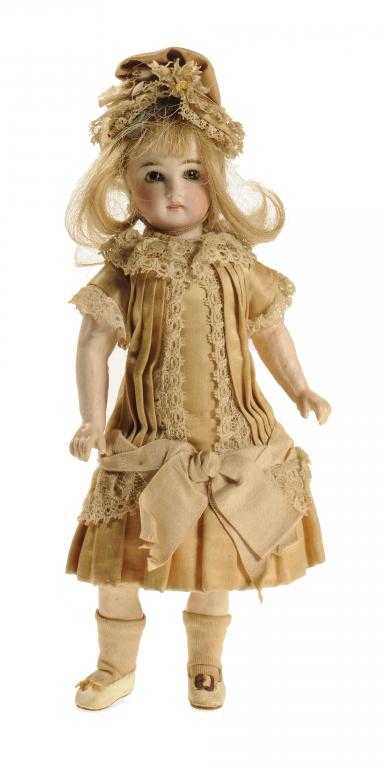 Appraisal: A FRENCH-MARKET DOLL the bisque head with fixed hazel glass