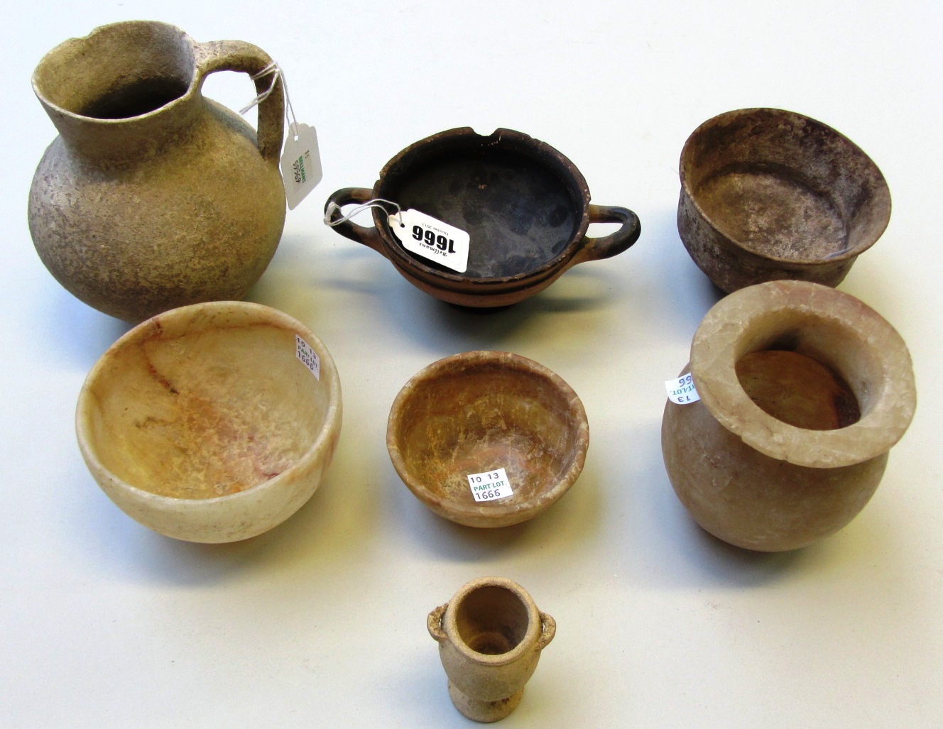 Appraisal: A group of pottery and alabaster vessels including a Greek