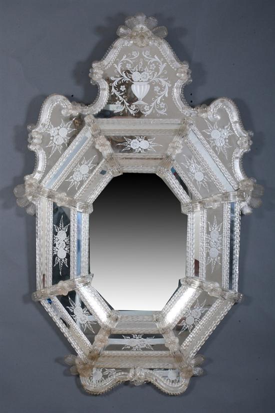 Appraisal: VENETIAN CARTOUCHE-FORM WALL MIRROR early th century Rosette-topped shaped crest