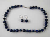 Appraisal: A lapis lazuli bead necklace with matching earrings largest beads