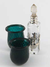 Appraisal: A silver mounted cut glass scent bottle the tall square