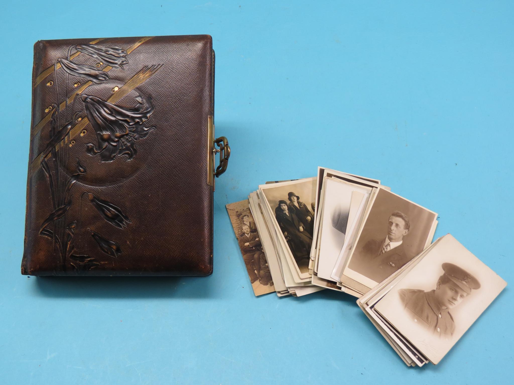 Appraisal: A late Victorian leather photograph album with sprung brass clasp