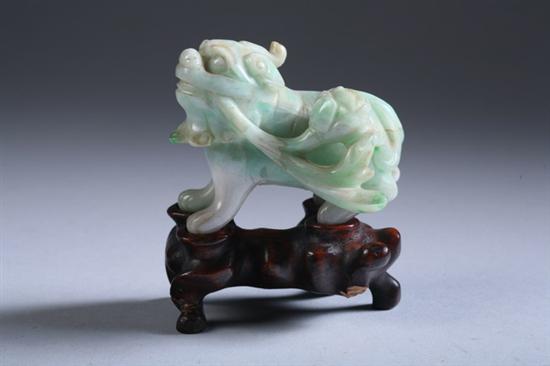 Appraisal: CHINESE CELADON AND APPLE GREEN JADE FIGURE OF FU DOG