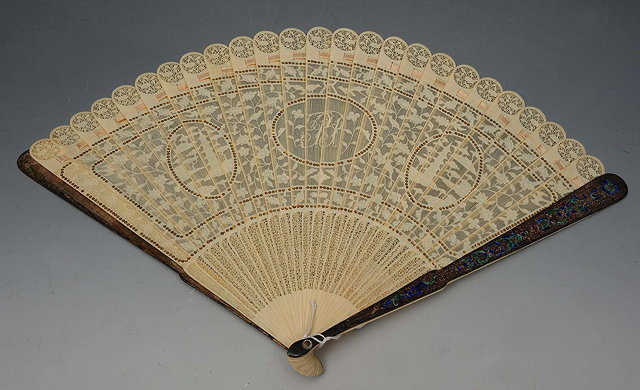 Appraisal: A CHINESE EXPORT PIERCED IVORY FAN with central monogram and