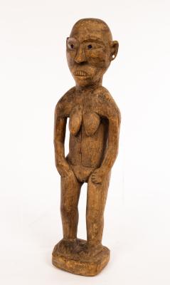 Appraisal: An African carved tribal figure of a grotesque nude on