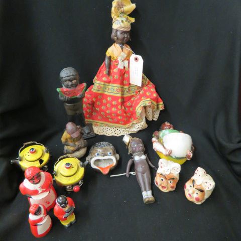 Appraisal: pcs Black Americana still banks celluliod kewpie salt peppers doll