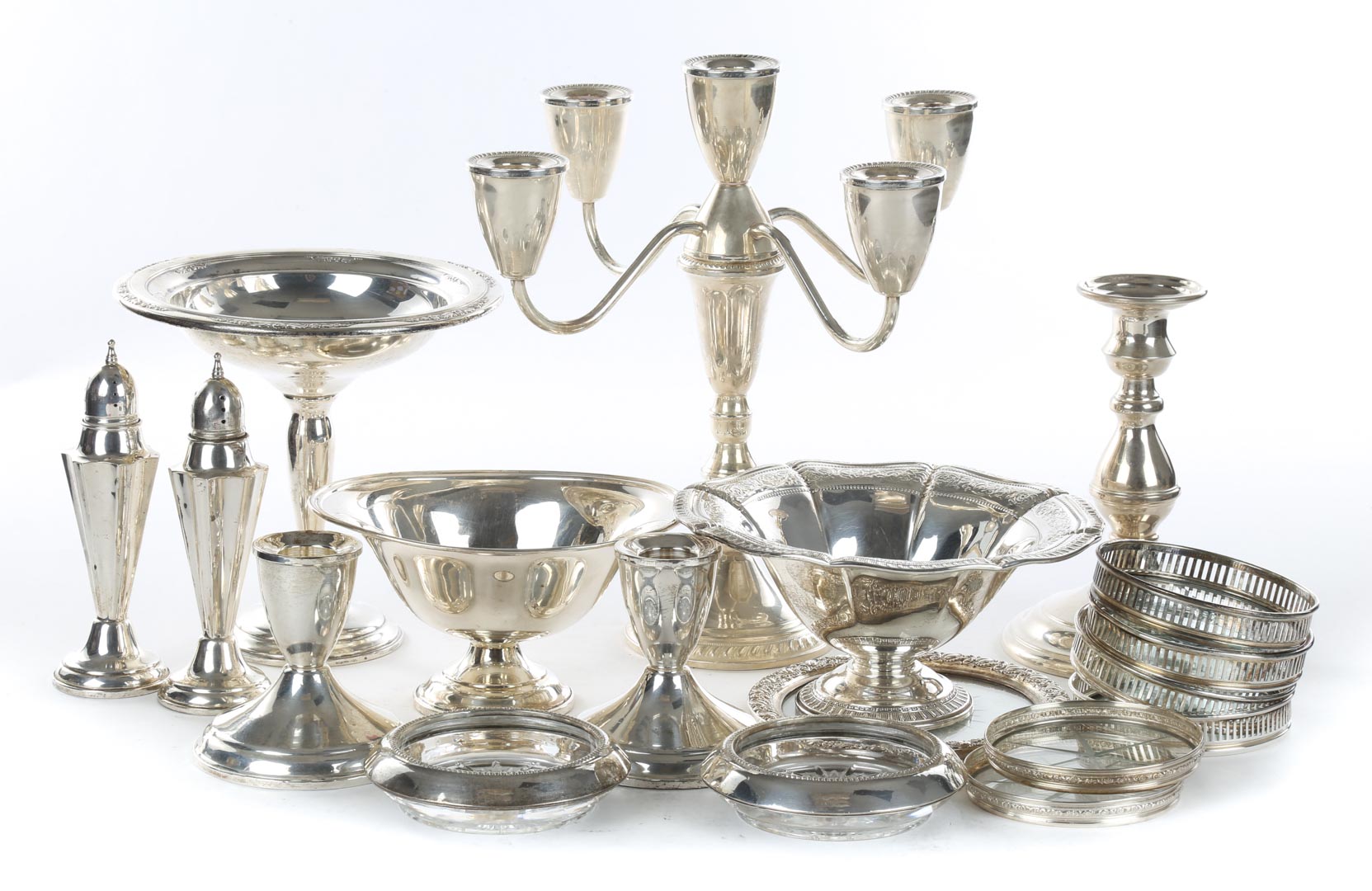 Appraisal: Assorted weighted sterling silver table articles comprising three candlesticks three