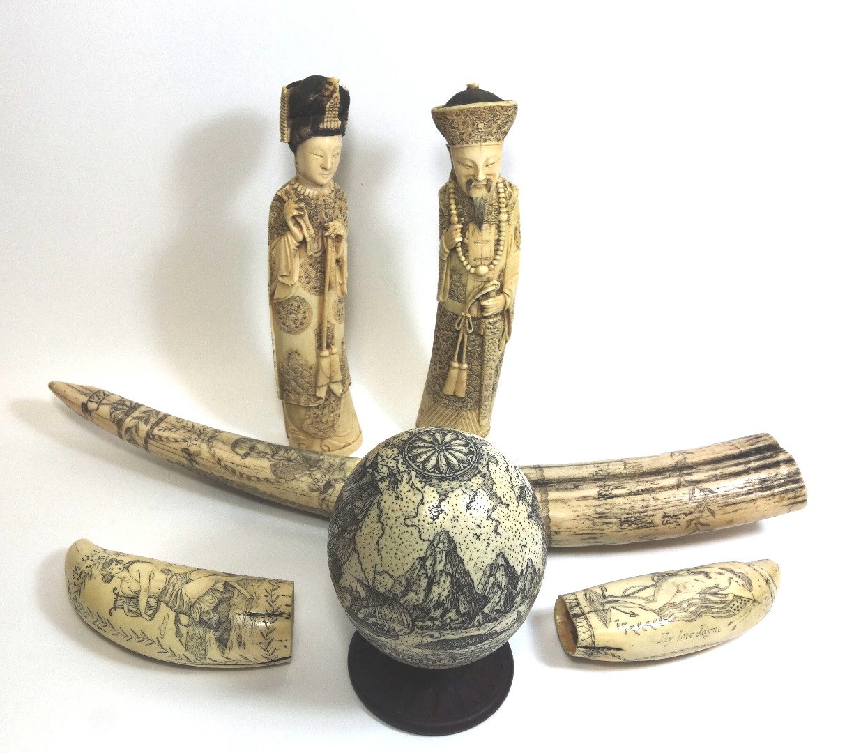 Appraisal: A collection of four pieces of reproduction Scrimshaw and a