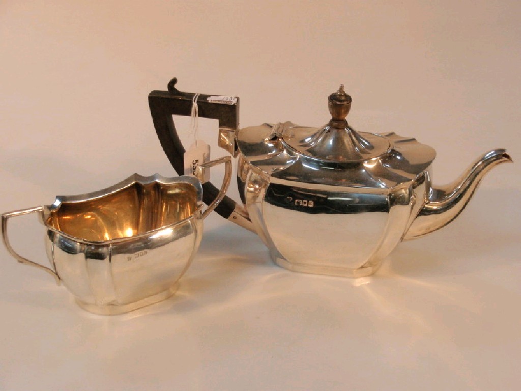 Appraisal: A George V silver teapot and matching sugar bowl by