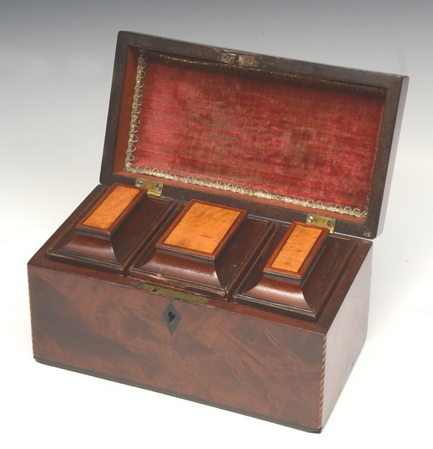 Appraisal: A GEORGIAN MAHOGANY THREE DIVISIONAL RECTANGULAR TEA CADDY with crossbanded