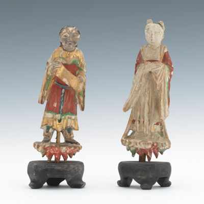 Appraisal: Two Carved and Polychromed Figural Ornaments Delicately carved wood figures