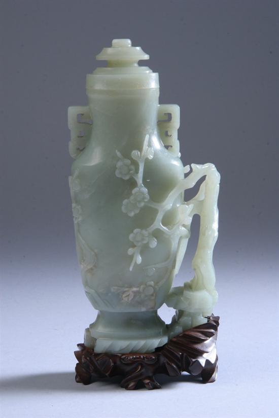 Appraisal: CHINESE WHITE JADE VASE AND COVER th century Flattened ovoid