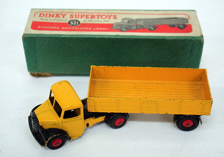 Appraisal: A DINKY SUPERTOYS NUMBER BEDFORD ARTICULATED LORRY yellow body and