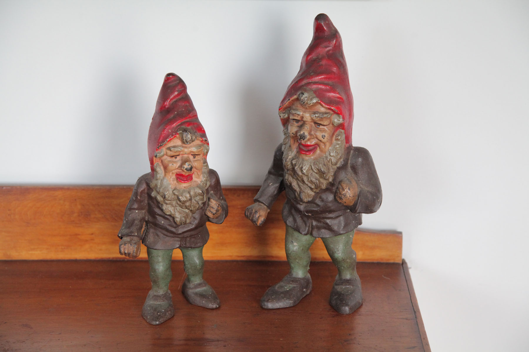 Appraisal: TWO CAST IRON ELVES GNOMES American first half of th