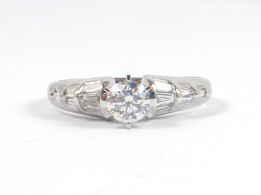 Appraisal: DIAMOND AND FOURTEEN KARAT WHITE GOLD RING with six tapered