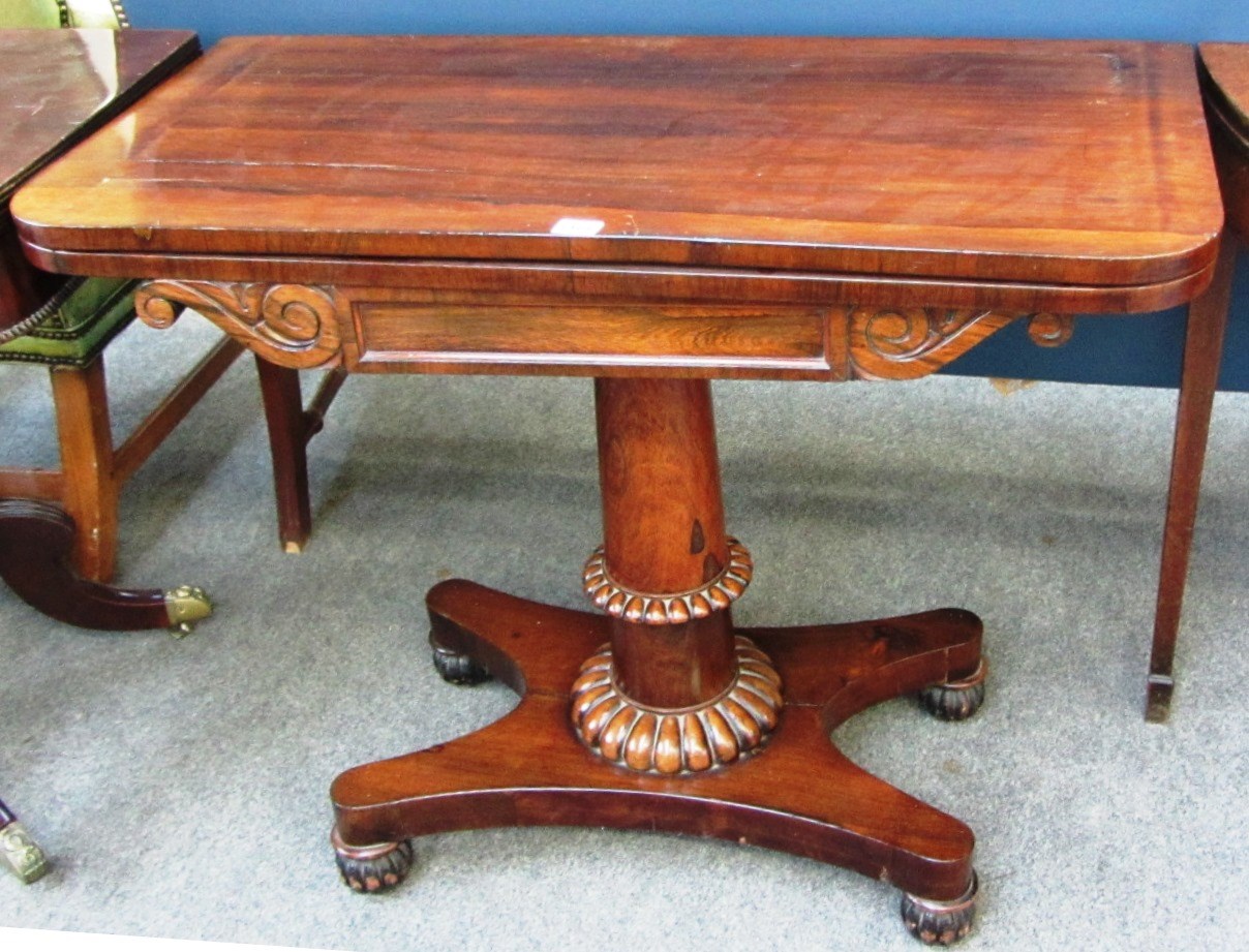 Appraisal: A William IV rosewood card table on quatrafoil platform cm