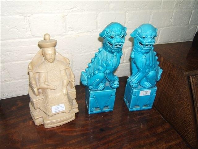 Appraisal: A pair of blue glazed porcelain dogs of foe each