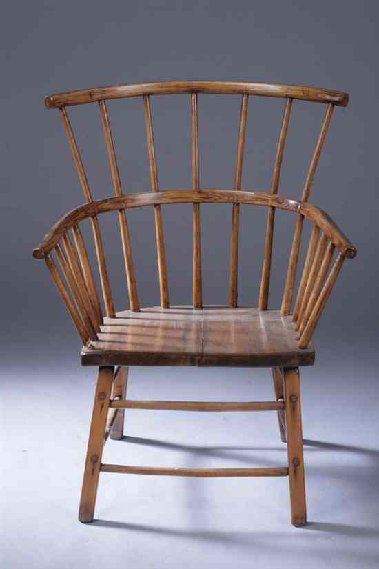 Appraisal: WINDSOR MIXED WOOD ARM CHAIR Bird cage crest spindle turned