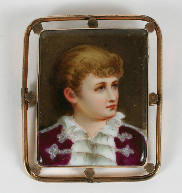 Appraisal: Porcelain miniature portrait brooch depicting a young boy within K