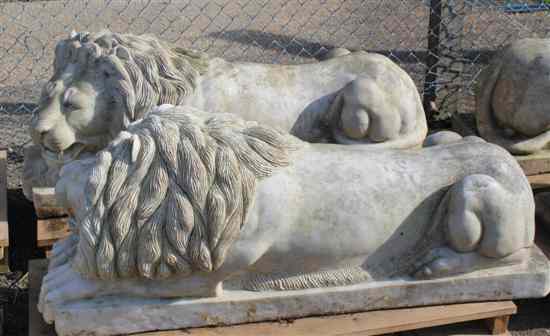 Appraisal: A pair of Indian carved white marble recumbent lions ft