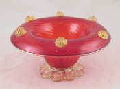 Appraisal: A Murano glass bowl the ruby swirl vase on plain