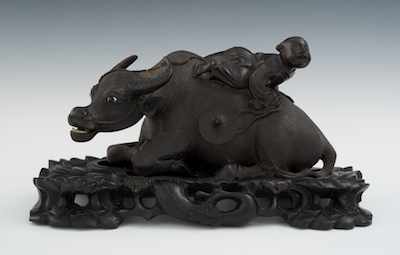 Appraisal: A Carved Rosewood Grouping of Ox and Boy on Carved