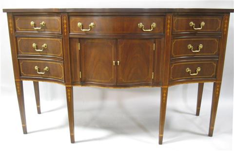 Appraisal: HENKEL HARRIS INLAID MAHOGANY SIDEBOARD The serpentine top over outward