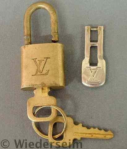 Appraisal: Small brass Louis Vuitton padlock with two keys and a