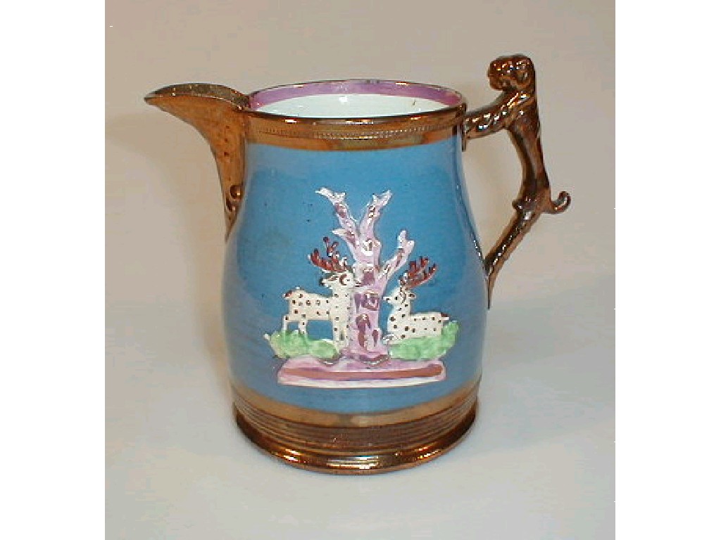 Appraisal: A Victorian purple lustre jug moulded in relief with stags