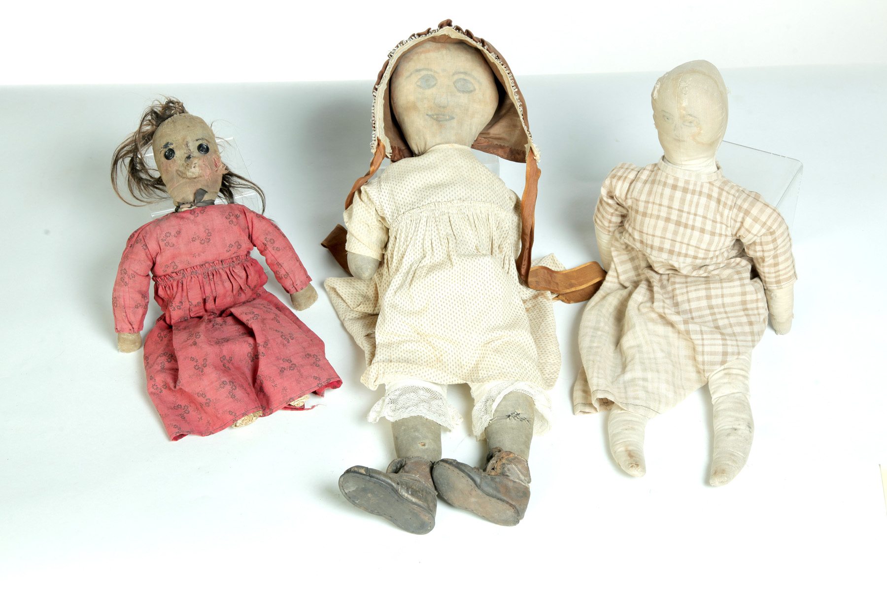 Appraisal: THREE AMERICAN DOLLS Late th-early th century Homemade stuffed cloth