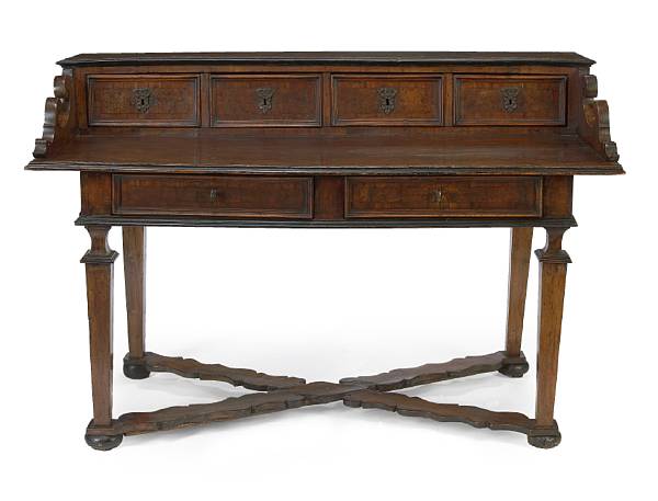 Appraisal: An Italian Baroque style walnut desk incorporating antique and later