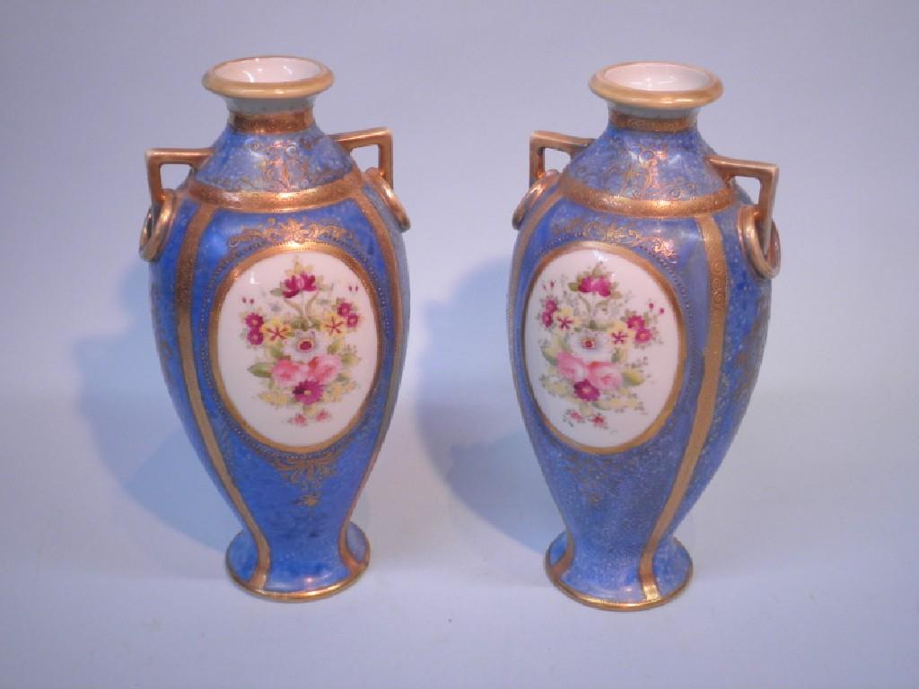 Appraisal: A pair of Noritake two handled porcelain vases each decorated