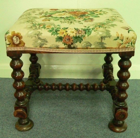 Appraisal: A th Century upholstered stool on bobbin turned supports and