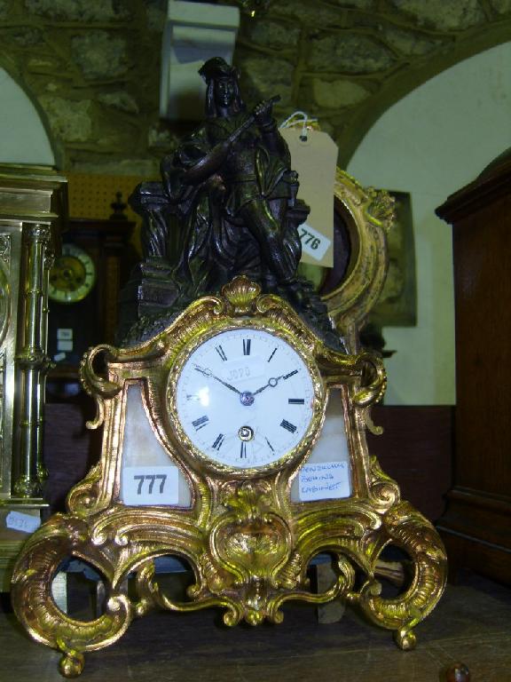 Appraisal: A mid th century gilded brass mantle clock in a