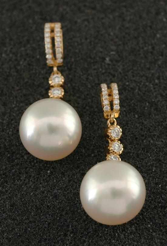 Appraisal: A pair of South Sea pearl and diamond earrings Each