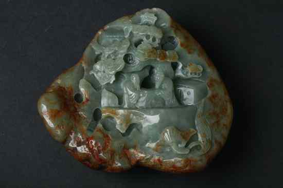 Appraisal: CHINESE CELADON JADE PEBBLE Carved to depict scholars under pine