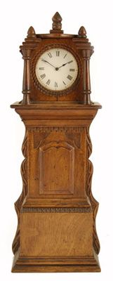 Appraisal: A miniature oak longcase clock with a platform cylinder escapement