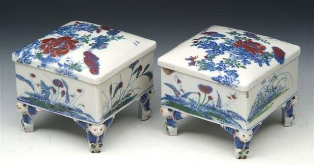 Appraisal: A PAIR OF JAPANESE SQUARE POTS and covers with child