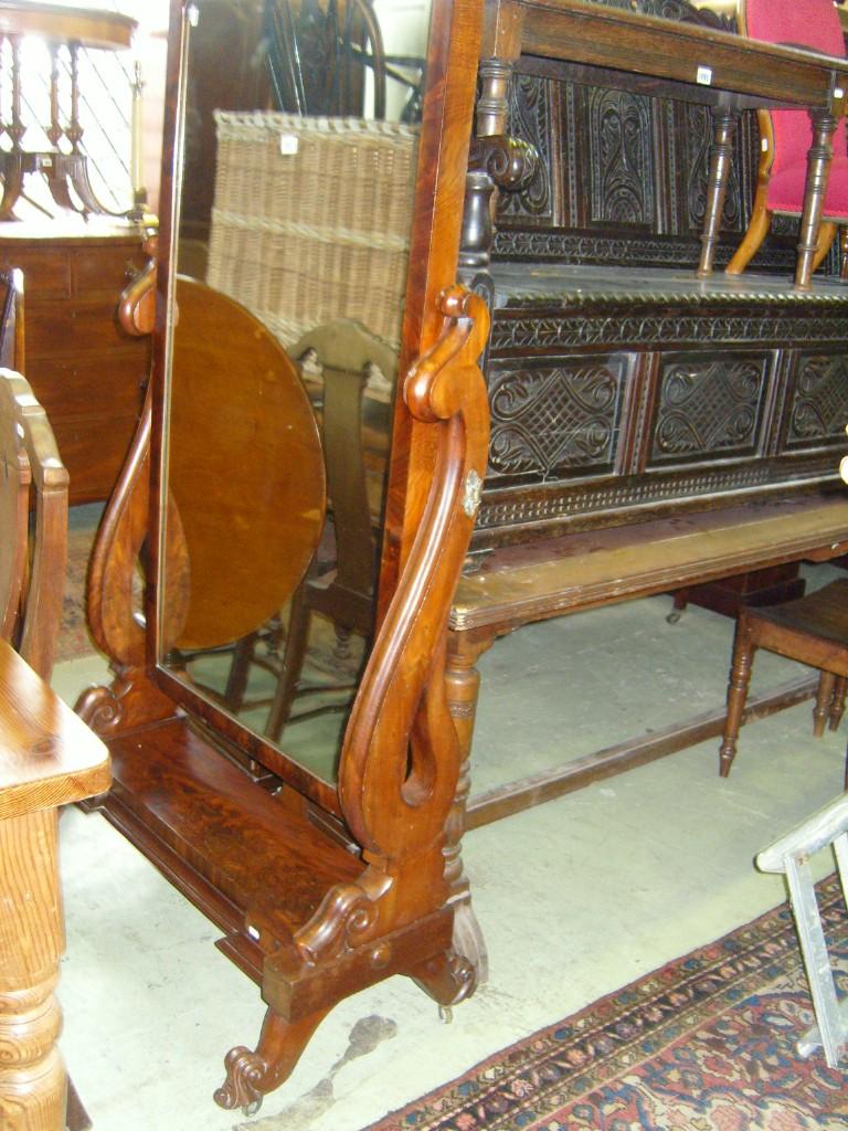 Appraisal: A large Victorian mahogany cheval glass the rectangular mirror plate