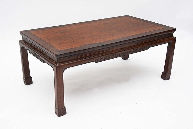 Appraisal: A CHINESE PADOUK WOOD OPIUM TABLE with rectangular top standing