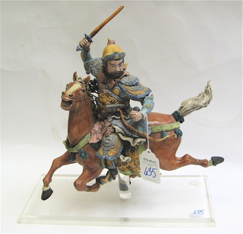 Appraisal: CHINESE GLAZED POTTERY SCULPTURE of a warrior in full regalia