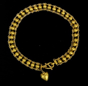 Appraisal: A High Karat Gold Bracelet with Heart Charm High karat