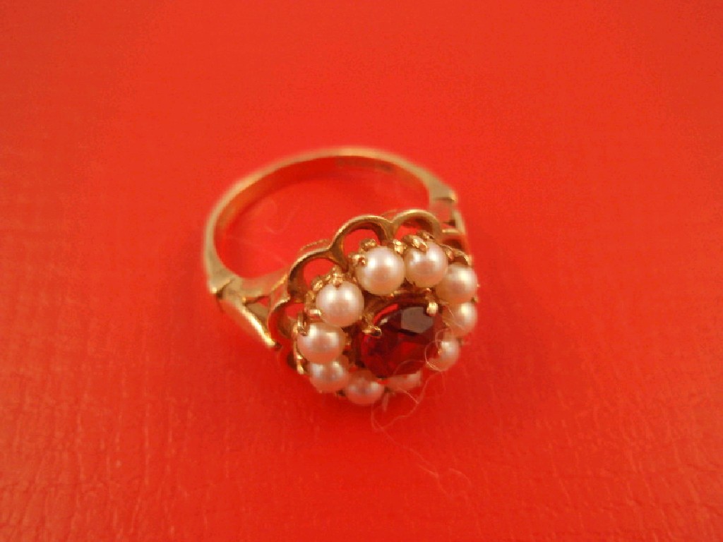 Appraisal: A garnet and pearl set dress ring set in ct