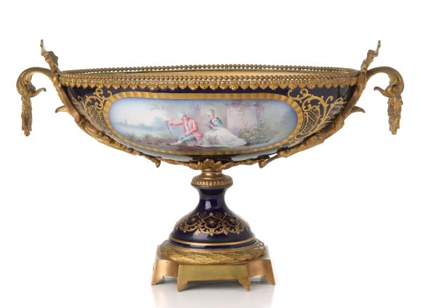 Appraisal: A SEVRES STYLE BRONZE MOUNTED PORCELAIN CENTERPIECEThe oval centerpiece with